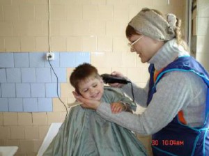 “Grandma” Tanya giving a haircut.