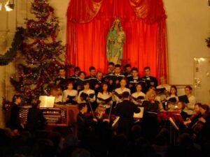 The Catholic Concert Choir of Vladivostok performs during the Christmas 2003 concert, along with the Regina Angelorum chamber orchestra.