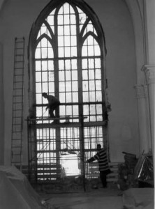 Workmen removing the old windows.